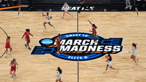 A detailed view of the March Madness center court logo during the first quarter between the Virginia Tech Hokies and the Ohio State Buckeyes at Climate Pledge Arena.